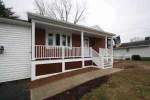 front of home with deck and stair remodel