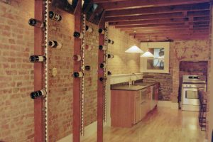 basement with wine rack and kitchen