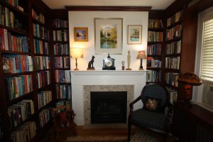 Home library with fireplace