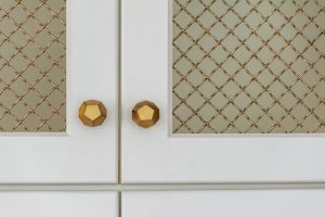 close up of gold kitchen cabinet knobs