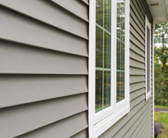A home with new grey vinyl siding