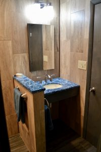 bathroom remodel with blue marble countertops
