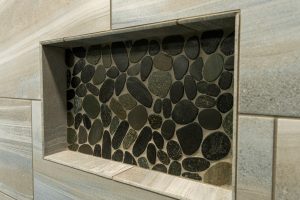 close up of stone shelf in new shower remodel