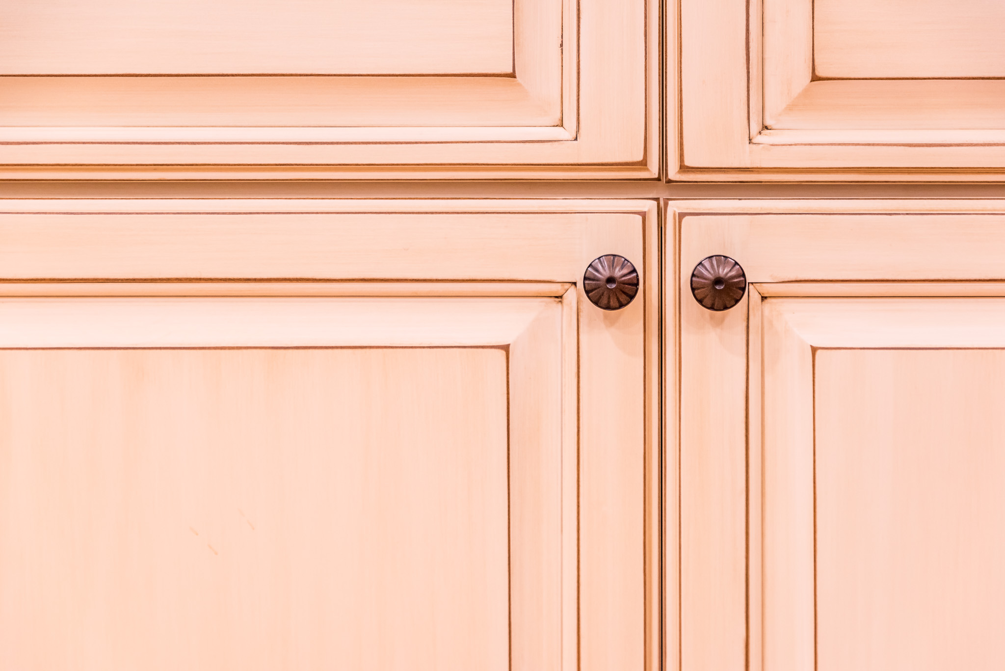 close up of tan kitchen cabinets