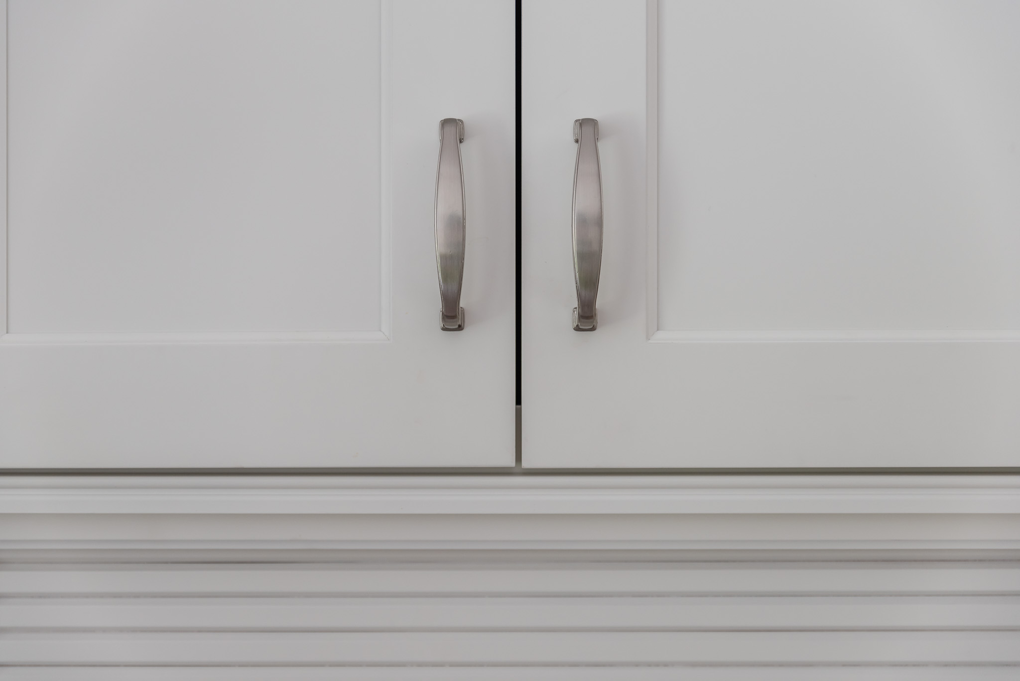 close up of white kitchen cabinets