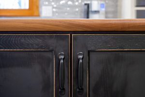 close up of black kitchen cabinets