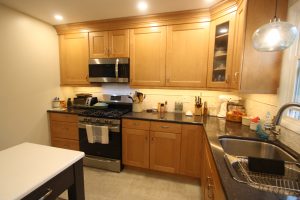 new kitchen with wooden cabinets
