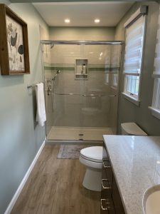 remodeled bathroom with glass shower doors