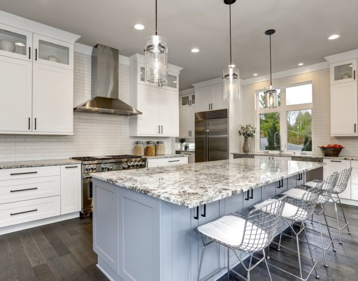 big white kitchen cabinets and white and grey marble countertops