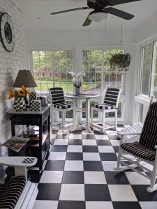 white and black striped theme porch room modeled with white and black checkered floor