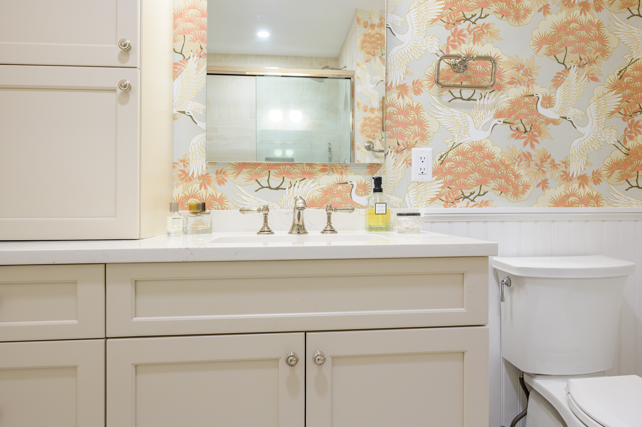 bright swan and flower pattern walls in new remodeled bathroom