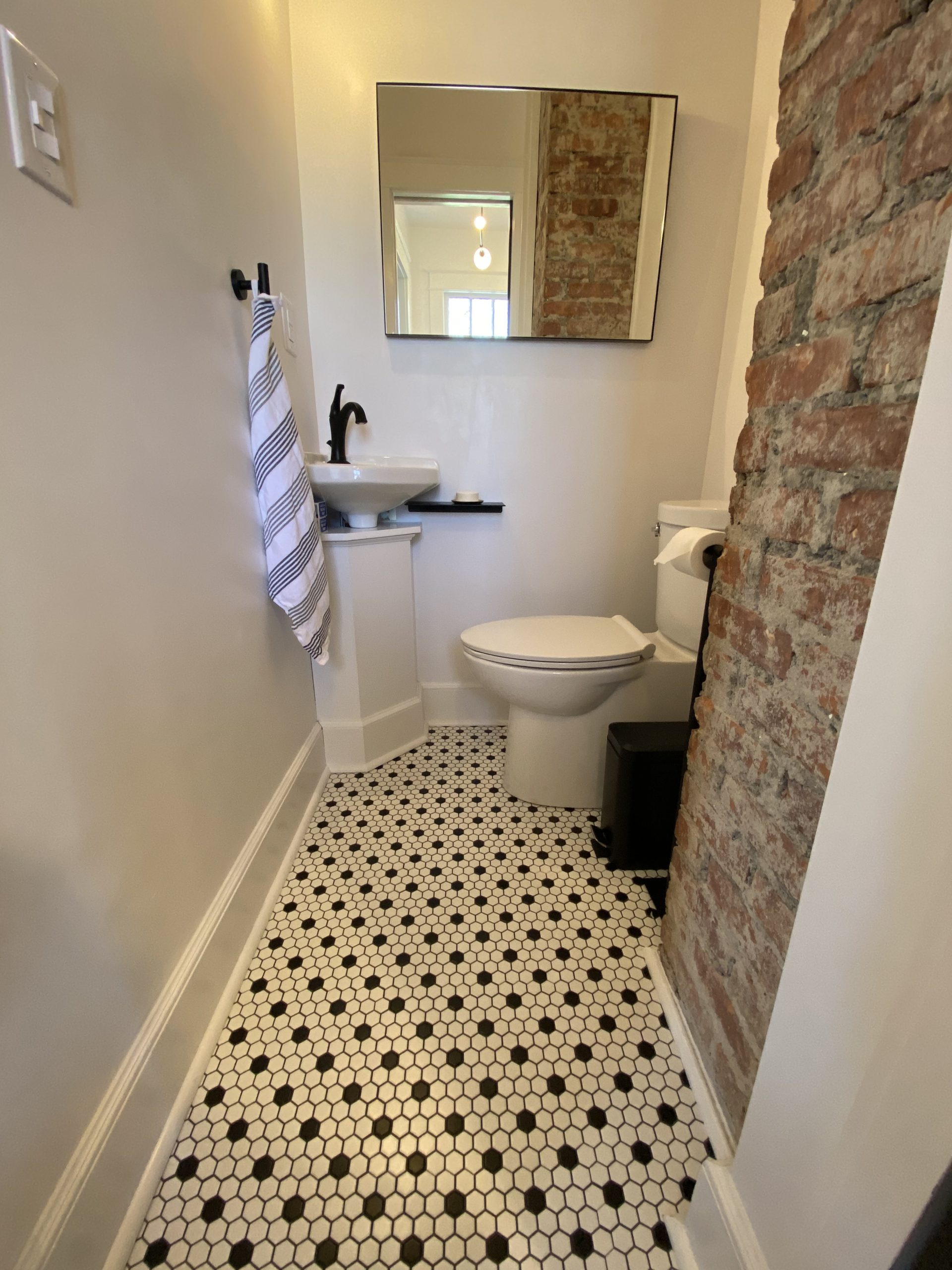black and white patterened floor on a bathroom remodel in chatham, ny