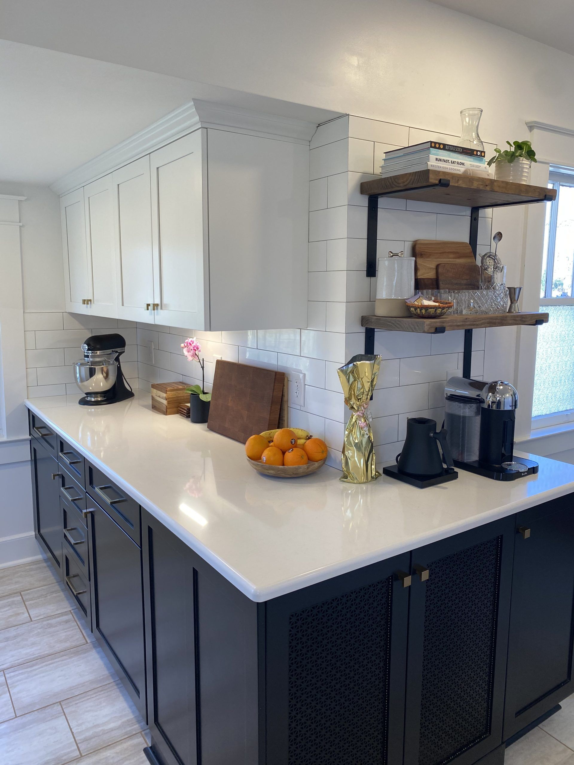 gorgeous white counter tops with navy blue cabinets on a kitcehn remodel in chatham, ny