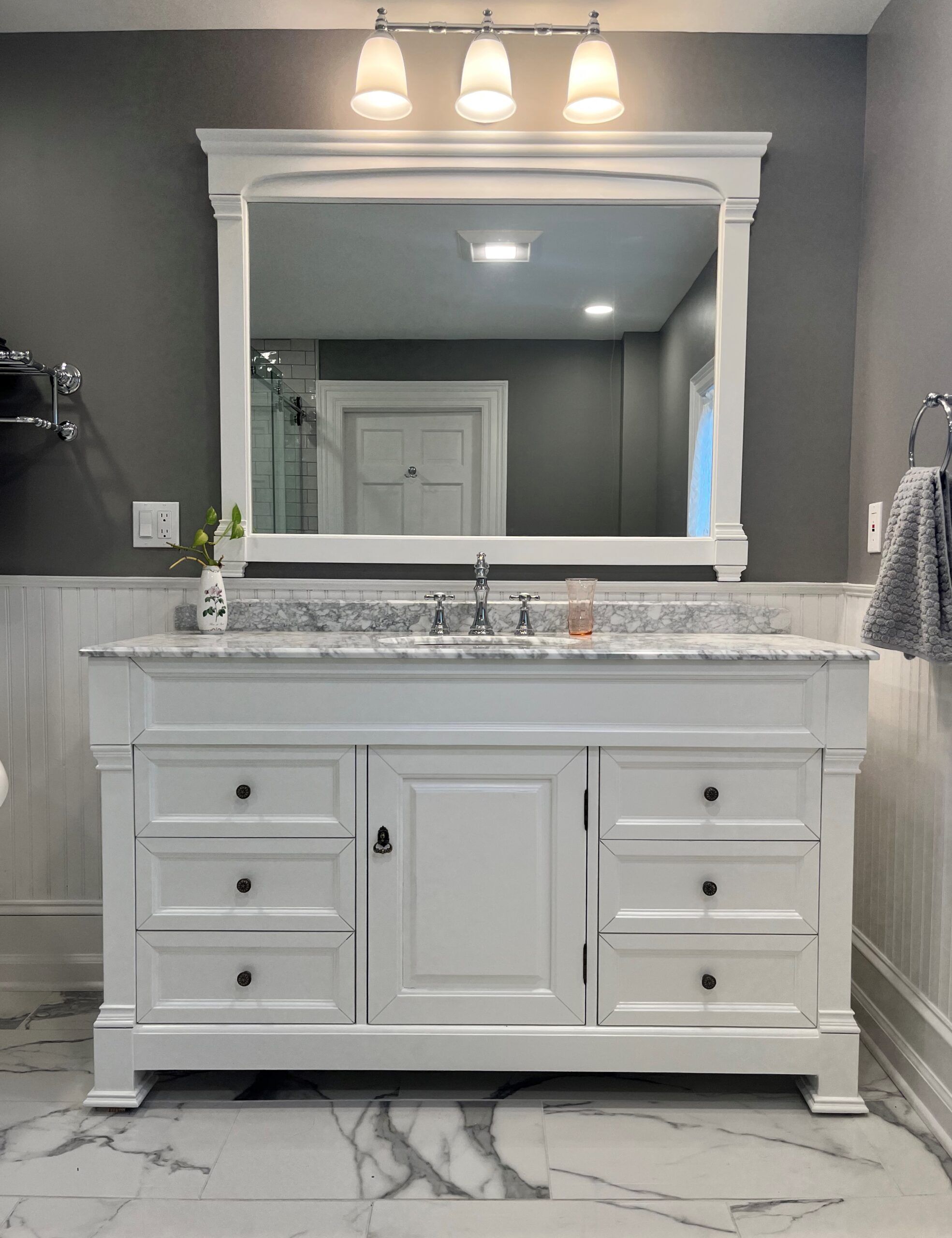 victorian farmhouse bathroom remodel with gorgeous white cabinets in the bathroom
